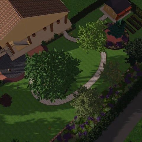 Aerial view of a residential backyard with lawn, curved stone pathway, flowering shrubs, and landscaping near a house